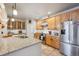 Modern kitchen boasts stainless steel appliances, granite countertops, and custom cabinets at 1100 Cherokee St # 304, Denver, CO 80204