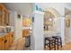 Charming kitchen featuring breakfast bar with seating, granite countertops, and tile flooring at 1100 Cherokee St # 304, Denver, CO 80204