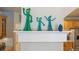 Shelf with Gumby and friends on display in a home with wood cabinets at 1100 Cherokee St # 304, Denver, CO 80204