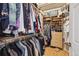 Spacious walk-in closet with custom shelving, drawers, and ample storage space at 1100 Cherokee St # 304, Denver, CO 80204
