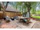 Outdoor patio with a comfortable seating area and a rustic shed at 32 Powder Horn Pl, Longmont, CO 80504