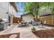 Inviting backyard with a patio seating area, grill, and lush landscaping at 32 Powder Horn Pl, Longmont, CO 80504