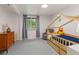 Bright bedroom with a house frame bed and a window with curtains at 32 Powder Horn Pl, Longmont, CO 80504