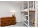 A room features a dresser and a bunk bed with a ladder at 32 Powder Horn Pl, Longmont, CO 80504
