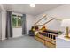 Bright bedroom with a house frame bed, window with curtains and a chair at 32 Powder Horn Pl, Longmont, CO 80504