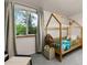 Cozy bedroom with a house frame bed and a window with natural light coming through at 32 Powder Horn Pl, Longmont, CO 80504