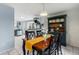 Bright dining area with a wooden table and views into an adjacent kitchen at 32 Powder Horn Pl, Longmont, CO 80504