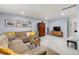Cozy living room showcasing a comfortable sectional, neutral carpet, and elegant decor at 32 Powder Horn Pl, Longmont, CO 80504
