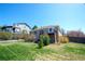 Spacious backyard featuring a patio and well-maintained lawn at 11606 Sagewood Ln, Parker, CO 80138