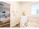 Relaxing bathroom with a soaking tub and serene bedroom view at 11606 Sagewood Ln, Parker, CO 80138
