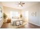 Serene bedroom with a ceiling fan, plantation shutters, and neutral decor at 11606 Sagewood Ln, Parker, CO 80138