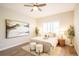 Well-lit bedroom with a stylish ceiling fan, accent plants, and soft decor creating a serene space at 11606 Sagewood Ln, Parker, CO 80138