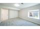 Bedroom featuring neutral carpet, light walls, a window, and a closet, offering a practical and inviting space at 11606 Sagewood Ln, Parker, CO 80138