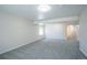 Spacious bedroom with neutral carpet, light walls, and a window, complemented by a bathroom at 11606 Sagewood Ln, Parker, CO 80138