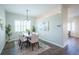 Dining room featuring a chandelier, seating for six, and plantation shutters at 11606 Sagewood Ln, Parker, CO 80138