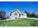 A spacious brick home with a well-maintained lawn and a two-car garage at 11606 Sagewood Ln, Parker, CO 80138