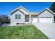 Inviting single-Gathering brick home with a well-kept lawn and an attached two-car garage at 11606 Sagewood Ln, Parker, CO 80138
