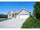 Beautiful single story brick home featuring a well-maintained lawn and a two-car garage at 11606 Sagewood Ln, Parker, CO 80138