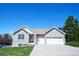 Charming brick home with a manicured lawn and a spacious two-car garage at 11606 Sagewood Ln, Parker, CO 80138