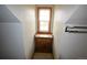 Well-lit attic space featuring storage with a window and neutral paint at 74500 E 136Th Ave, Byers, CO 80103