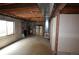 Unfinished basement featuring concrete walls, floor, and exposed utilities at 74500 E 136Th Ave, Byers, CO 80103