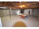 Unfinished basement featuring exposed ceilings and a pool table at 74500 E 136Th Ave, Byers, CO 80103