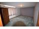 Spacious bedroom featuring ample natural light, soft gray walls, neutral curtains, and dark trim and a large armoire at 74500 E 136Th Ave, Byers, CO 80103