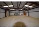 Large outbuilding interior with steel beams, roll up door, concrete floors and an abundance of space at 74500 E 136Th Ave, Byers, CO 80103