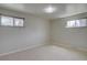 Bright bedroom with neutral carpet, two windows and light fixture at 6272 S Garfield Dr, Centennial, CO 80121