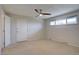 Bright bedroom with neutral carpet, a window, ceiling fan, and ample natural light at 6272 S Garfield Dr, Centennial, CO 80121