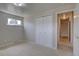 Bedroom featuring bi-fold closet doors and neutral carpeting at 6272 S Garfield Dr, Centennial, CO 80121