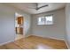 A dining room with gleaming hardwood floors and views into the kitchen at 6272 S Garfield Dr, Centennial, CO 80121