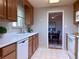 Functional kitchen featuring wood cabinets and adjacent dining area for easy meal service at 6272 S Garfield Dr, Centennial, CO 80121