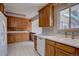 Classic kitchen featuring wood cabinets, white appliances, and a bright, functional layout perfect for everyday cooking and entertaining at 6272 S Garfield Dr, Centennial, CO 80121