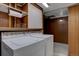 Basement laundry area with washer, dryer, and shelving at 6272 S Garfield Dr, Centennial, CO 80121