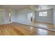 Inviting living room with hardwood floors, fresh paint, and natural light creating a warm and welcoming space for relaxation at 6272 S Garfield Dr, Centennial, CO 80121