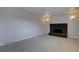 Cozy living room featuring a fireplace and neutral carpeting; ready for personalization at 6272 S Garfield Dr, Centennial, CO 80121