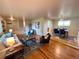 Open living and dining area featuring hardwood floors, neutral decor, and seamless flow for easy living at 6272 S Garfield Dr, Centennial, CO 80121