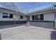 Charming patio space outside the home featuring concrete flooring and an awning at 6272 S Garfield Dr, Centennial, CO 80121