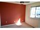 Bedroom with carpet and neutral paint, featuring a window and ceiling fan at 18121 E Adriatic Pl, Aurora, CO 80013