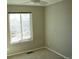 Bedroom with carpet and neutral paint, featuring a bright window and ceiling fan at 18121 E Adriatic Pl, Aurora, CO 80013