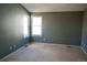 Spacious bedroom with neutral carpet and a bright window allowing ample natural light at 18121 E Adriatic Pl, Aurora, CO 80013