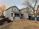 Charming two-story home with a covered front porch and blue-gray siding at 18121 E Adriatic Pl, Aurora, CO 80013