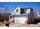 Charming two-story home features a well-maintained yard and attached two car garage at 18121 E Adriatic Pl, Aurora, CO 80013