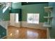 Bright living room featuring stairs, fresh paint and hardwood floors at 18121 E Adriatic Pl, Aurora, CO 80013