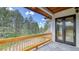Enjoy the outdoors on this private balcony with scenic views of towering trees at 11790 Huckleberry Dr, Franktown, CO 80116