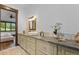 Bathroom featuring granite countertop, vanity with storage, and designer accents at 11790 Huckleberry Dr, Franktown, CO 80116