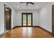 Bright bedroom boasts hardwood floors, ceiling fan, and door to private balcony at 11790 Huckleberry Dr, Franktown, CO 80116