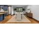 Dining room with wood floors, designer accents, large windows with wooded view at 11790 Huckleberry Dr, Franktown, CO 80116