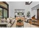 Bright living room with high ceilings, large windows, and elegant furnishings at 11790 Huckleberry Dr, Franktown, CO 80116